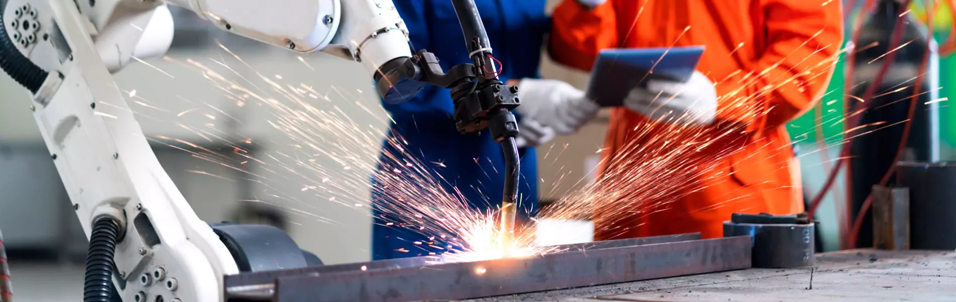 In manufacturing company people are working and machine working in progress