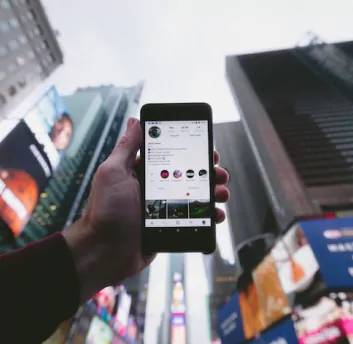 Social media app opened in mobile screen